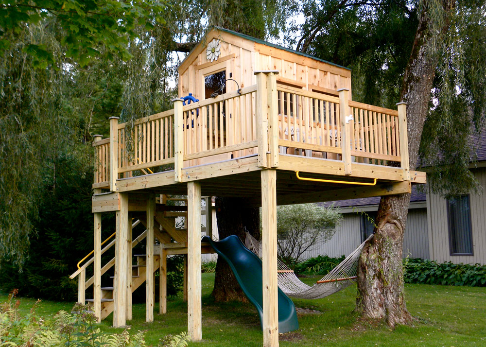 A treehouse designed with a Jamaica Cottage Shop Shed Pre-Cut Kit