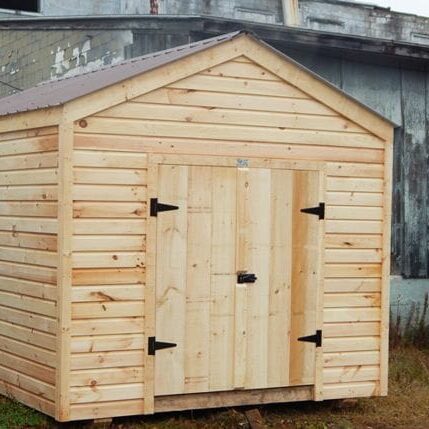 This 10x14 New Yorker storage shed was modified with siding and roof upgrades
